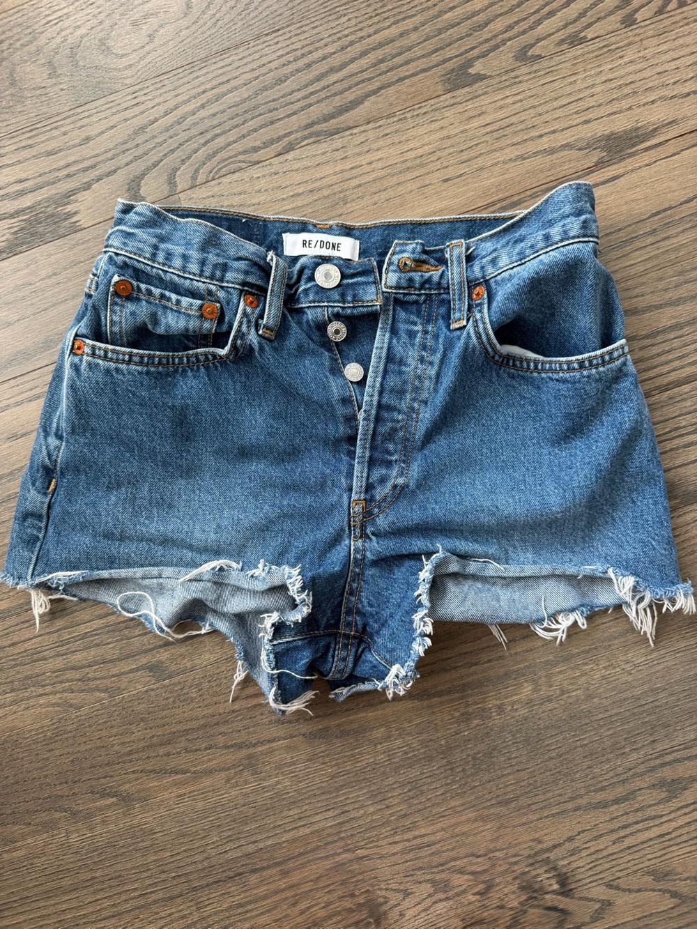 Re/Done Medium Blue Raw Hem Denim Cutoff Shorts